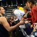 Michigan freshman Mitch McGary thanks a young fan for coming out to watch practice as the team signs autographs  at Cowboys Stadium in Arlington, Texas on Thursday, March 28, 2013. Melanie Maxwell I AnnArbor.com